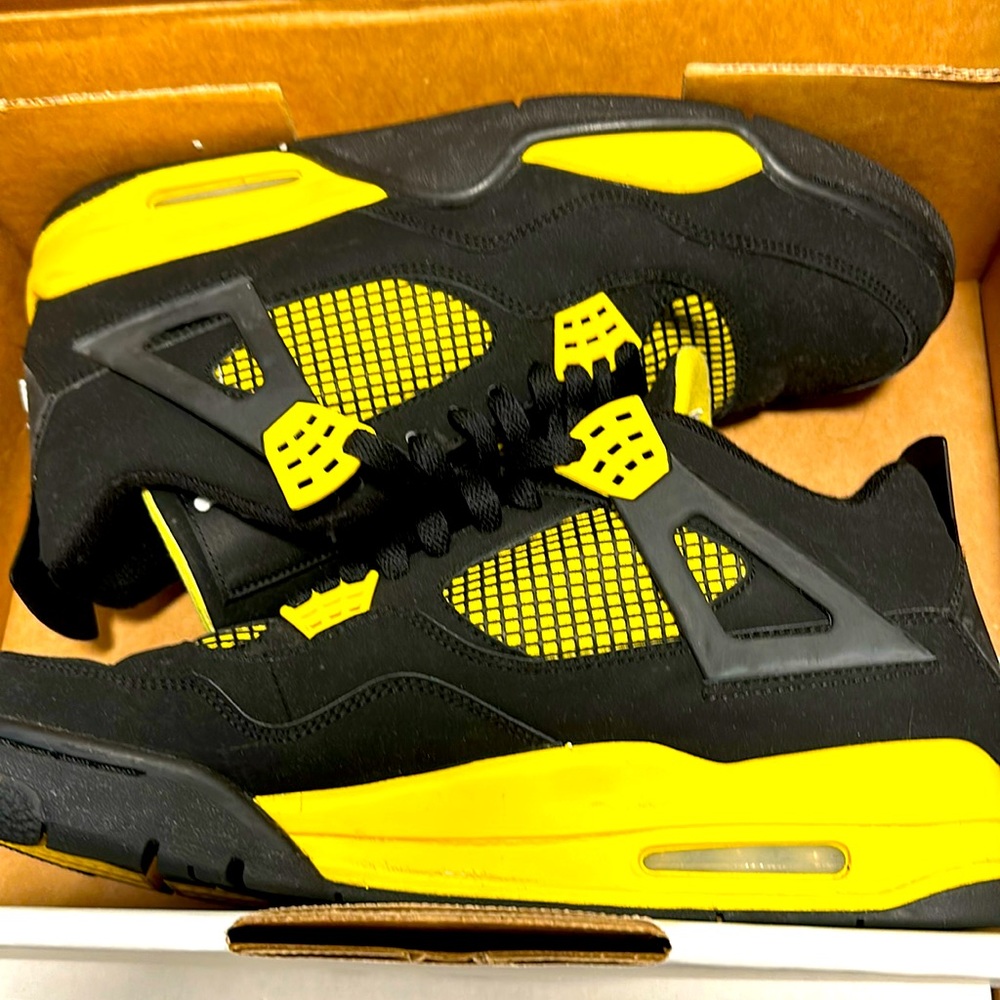 Black and yellow Jordans, not in original box.